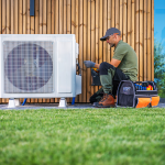 Technician servicing a home air conditioning unit.