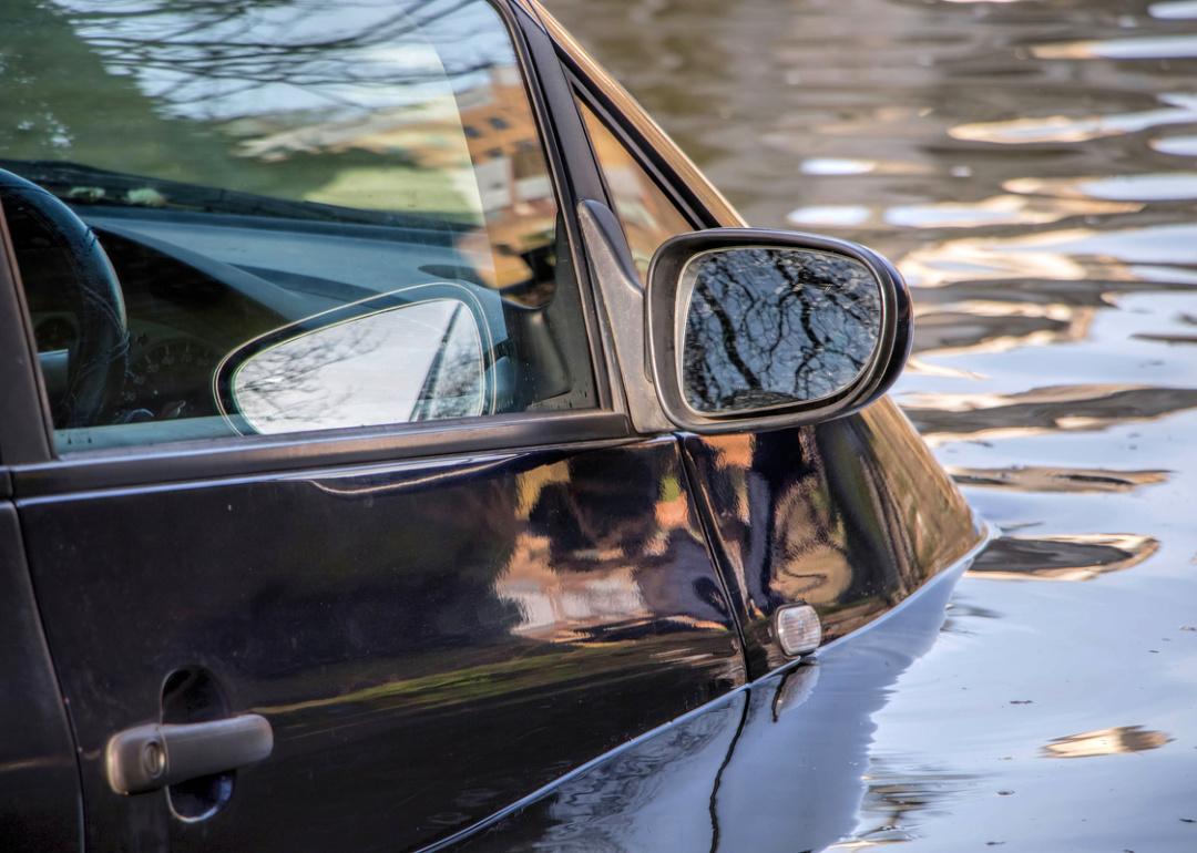 Car submerged in flood water.
