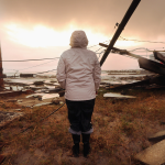 A resident stands among damage from Hurricane Sandy in Atlantic City, New Jersey.