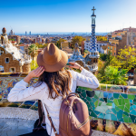 A tourist enjoys the view of the popular Park Güell in Barcelona.