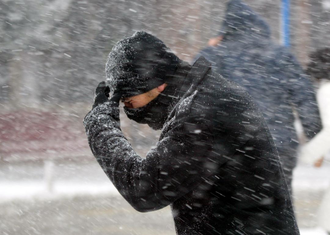 Person walking in cold snowy weather.