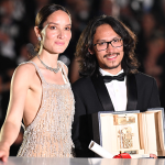 Pham Thien An poses with Anais Demoustier after he won the Camera d'Or at the Cannes Film Festival.