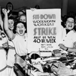 Workers holding sign for a 40-hour workweek