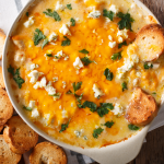 Bowl of buffalo chicken dip with crostini