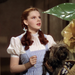 Dorothy (Judy Garland) with her dog Toto in "Wizard of Oz," realizing, "We're not in Kansas anymore"