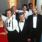 The cast of the Emmy award-winning drama series "The West Wing" poses for a publicity photo. In the front row, from left to right, are Allison Janney, Bradley Whitford, Martin Sheen, Richard Schiff, and Janel Moloney. In the back row, from left to right, are John Spencer, Rob Lowe, and Dule Hill.