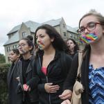 Boston College students marched along Commonwealth Avenue in Newton, Mass., on Sept. 29, 2016, as part of a protest on campus after the administration's non-response to anti-LGBT vandalization. 