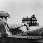 Iconic shot of James Dean in a car in front of a farmhouse in "Giant."