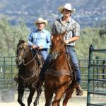 Robert Duvall and Josh Hartnett in cowboy hats riding horses in the 2015 movie "Wild Horses"