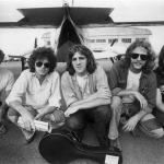 Bernie Leadon, Don Henley, Glenn Frey, Don Felder, and Randy Meisner of The Eagles pose in front of a plane in Australia in 1970.