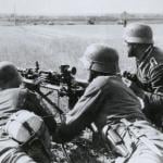 German soldiers fire a machine gun during the Nazi invasion of the Soviet Union (Russia) in the summer of 1941, during World War 2.