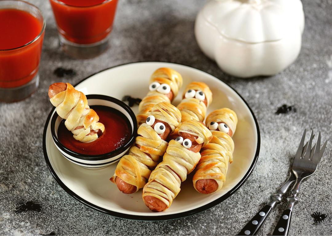 Hot dog mummies in dough with ketchup for the Halloween party.