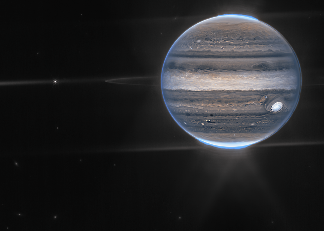 Webb NIRCam composite image from two filters – F212N (orange) and F335M (cyan) – of Jupiter system.