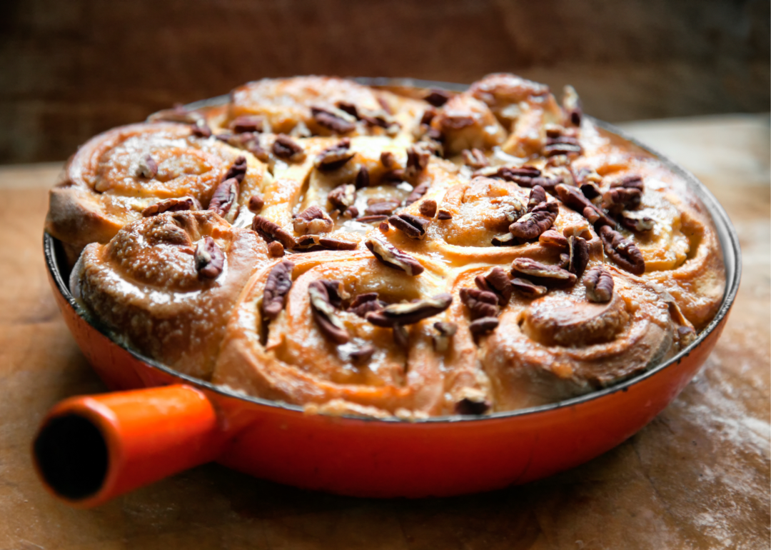 Salted caramel pecan sticky buns in a skillet