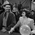 lark Gable at a carnival with Claudette Colbert in a scene from the 1940 film 'Boom Town'
