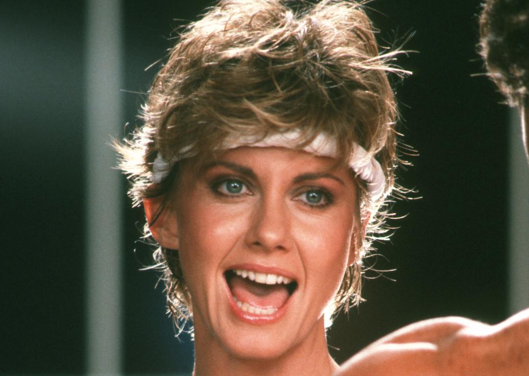 Olivia Newton-John in a headband performing in the music video for her single, 'Physical', in 1981.