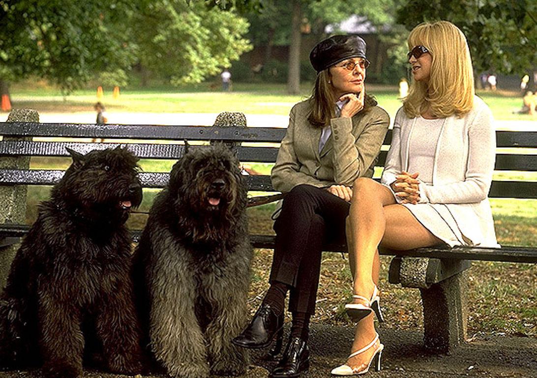 Diane Keaton and Goldie Hawn sit on a bench beside two dogs in the box-office bomb 'Town & Country.'