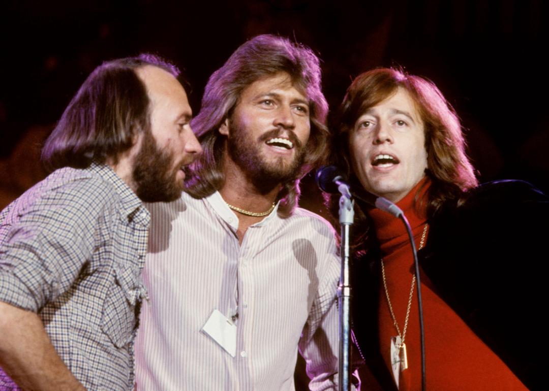 The Bee Gees—Maurice, Barry, and Robin Gibb—performing in the 1970s.