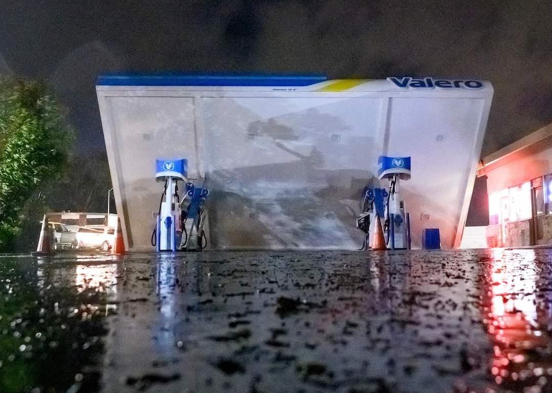 A damaged Valero gas station creaks in the wind during a massive "bomb cyclone" rain storm in South San Francisco on Jan. 4, 2023. 