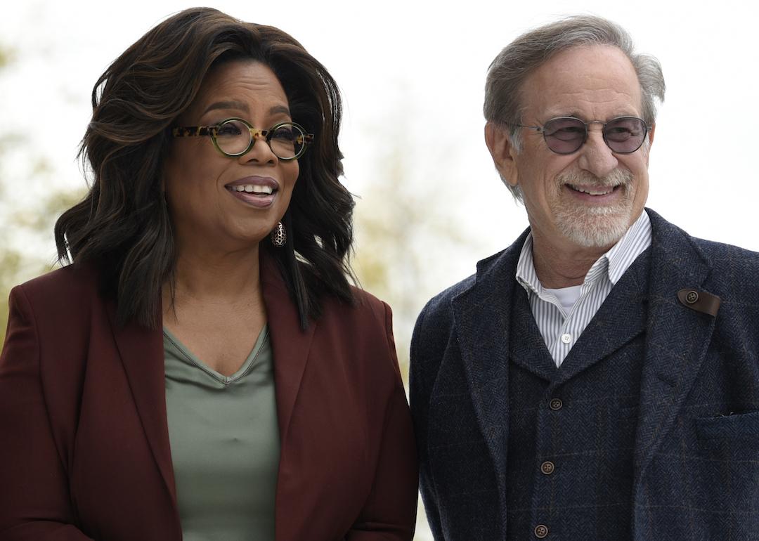Oprah Winfrey and Steven Spielberg pose at an Apple product launch event at the Steve Jobs Theater at Apple Park in Cupertino, California.