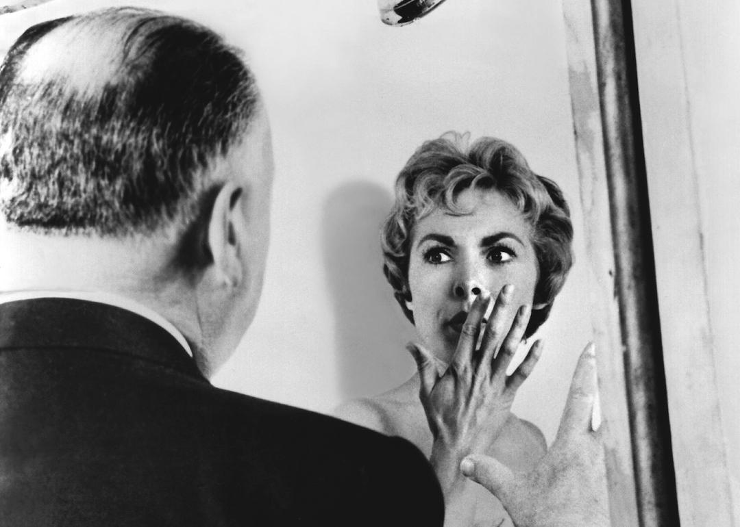 Film director Alfred Hitchcock directs Janet Leigh in the famous shower scene in 'Psycho.'