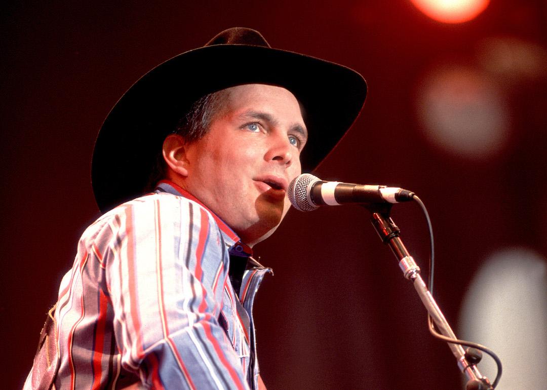 Country music artist Garth Brooks singing on stage in 1990.