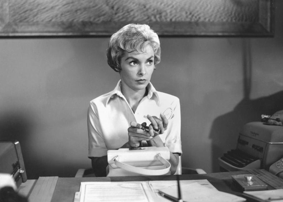 Actor Janet Leigh in 'Psycho' as secretary Marion Crane sitting at her desk.