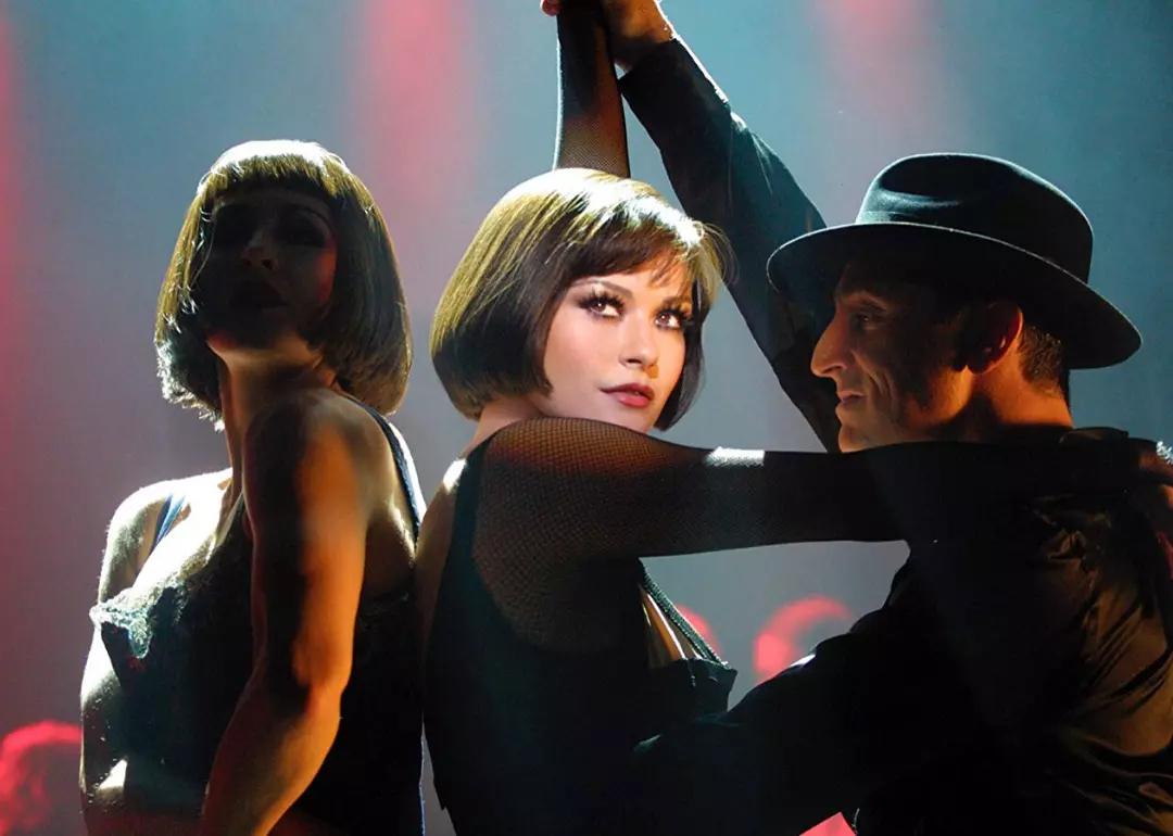 A spotlight shines on actor Catherine Zeta-Jones as she dances in the Oscar-winning movie musical 'Chicago.'