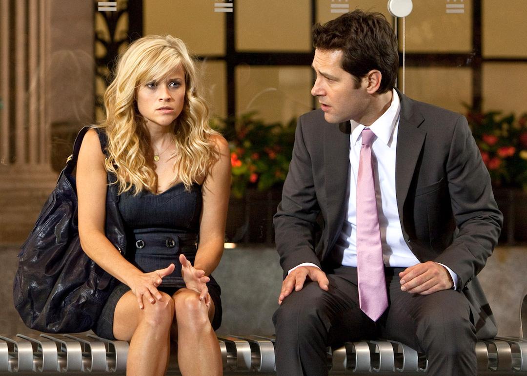 Actors Reese Witherspoon and Paul Rudd sit at a bus stop in the 2010 box-office bomb 'How Do You Know.'