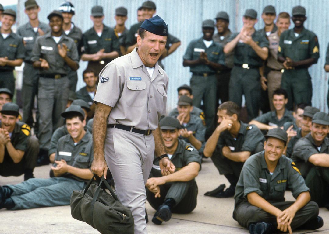 Actor Robin Williams with a group of soldiers in a scene from "Good Morning, Vietnam"