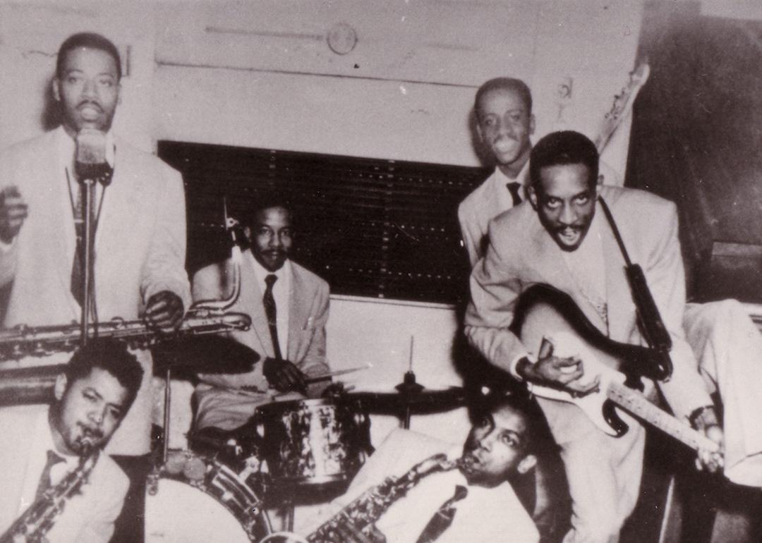 Ike Turner's Kings Of Rhythm in 1955—from left to right, Billy Gayles (holding bar), Raymond Hill, Eugene Washington, Eddie Jones, Ike Turner, and Jessie Knight Jr.
