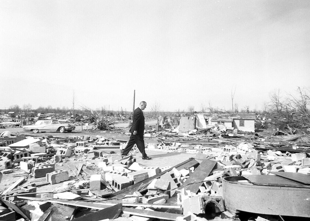 Then-President Lyndon Baines Johnson tours the wreckage after a Palm Sunday tornado outbreak in the Midwest in April 1965.