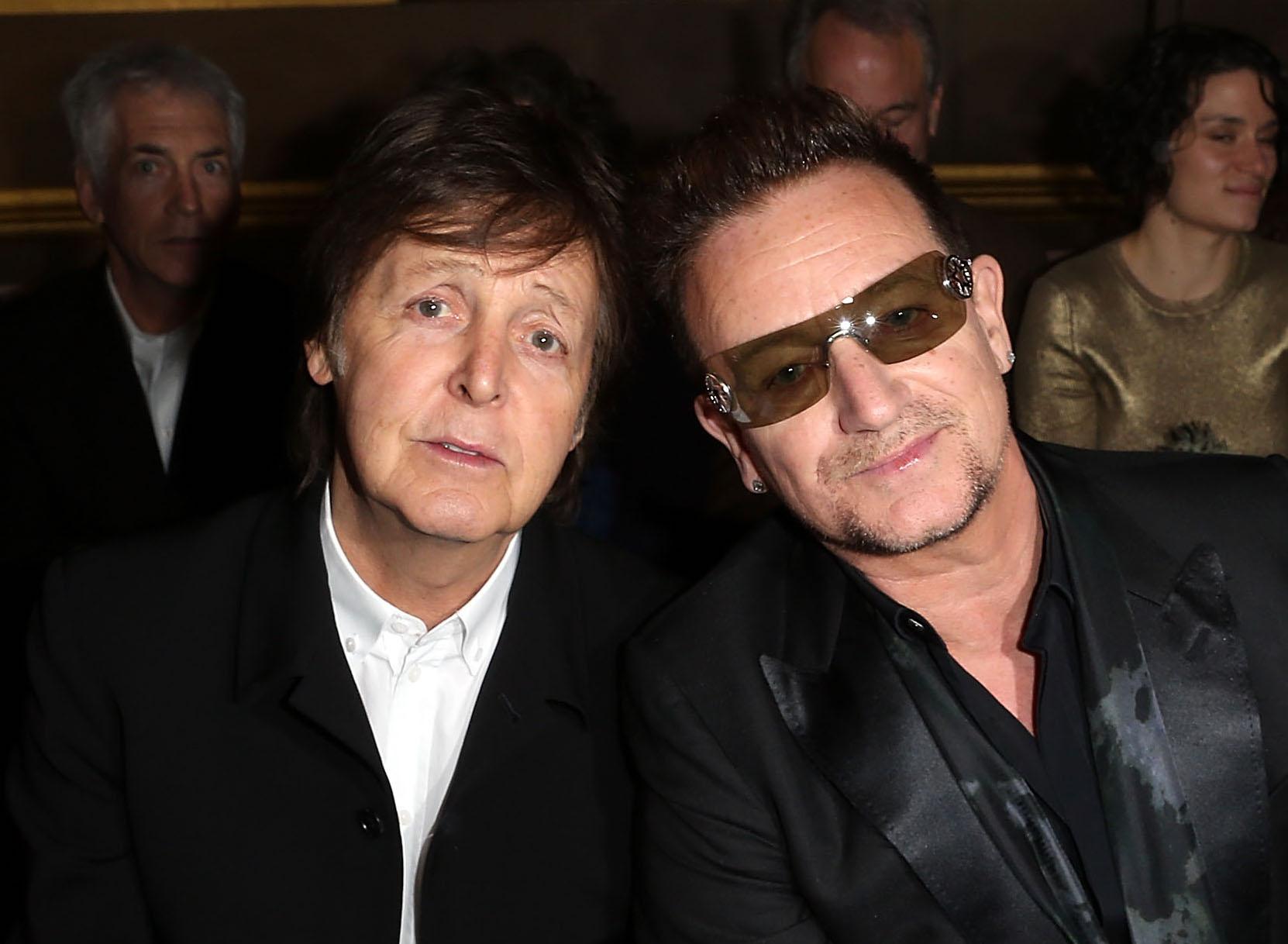 Sir Paul McCartney and Bono attend the Stella McCartney Fall/Winter 2013 Ready-to-Wear show as part of Paris Fashion Week on March 4, 2013 in Paris, France.
