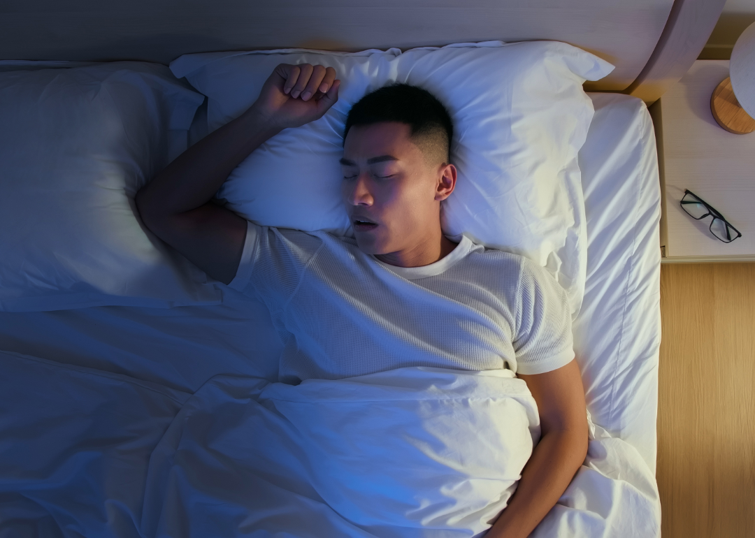 Person snoring in bed.