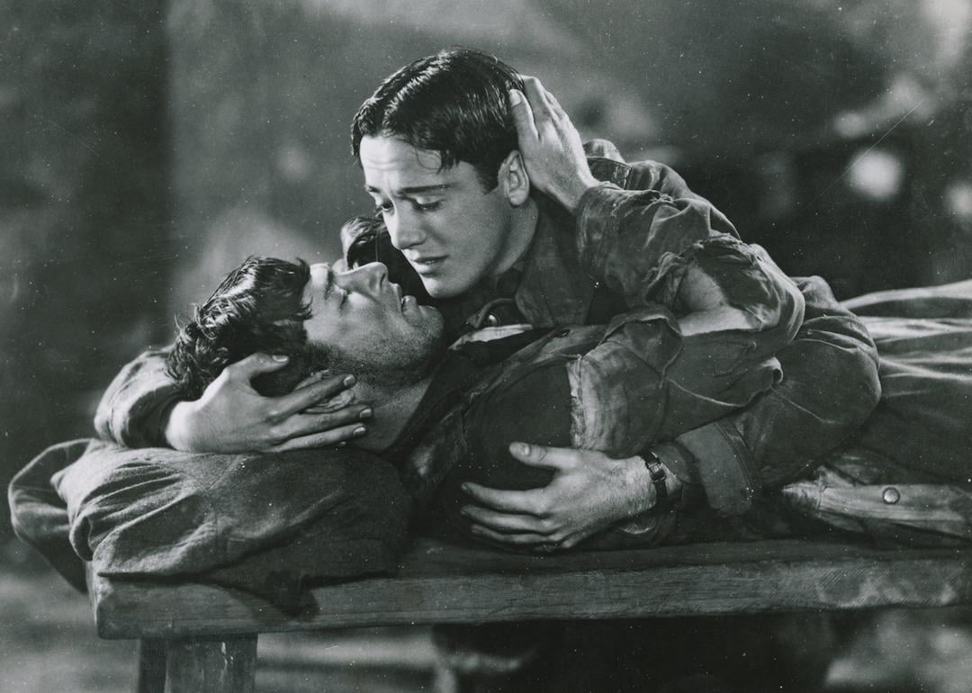 Charles (Buddy) Rogers holds and comforts Richard Arlen on his deathbed in a scene from the 1927 movie 'Wings.'