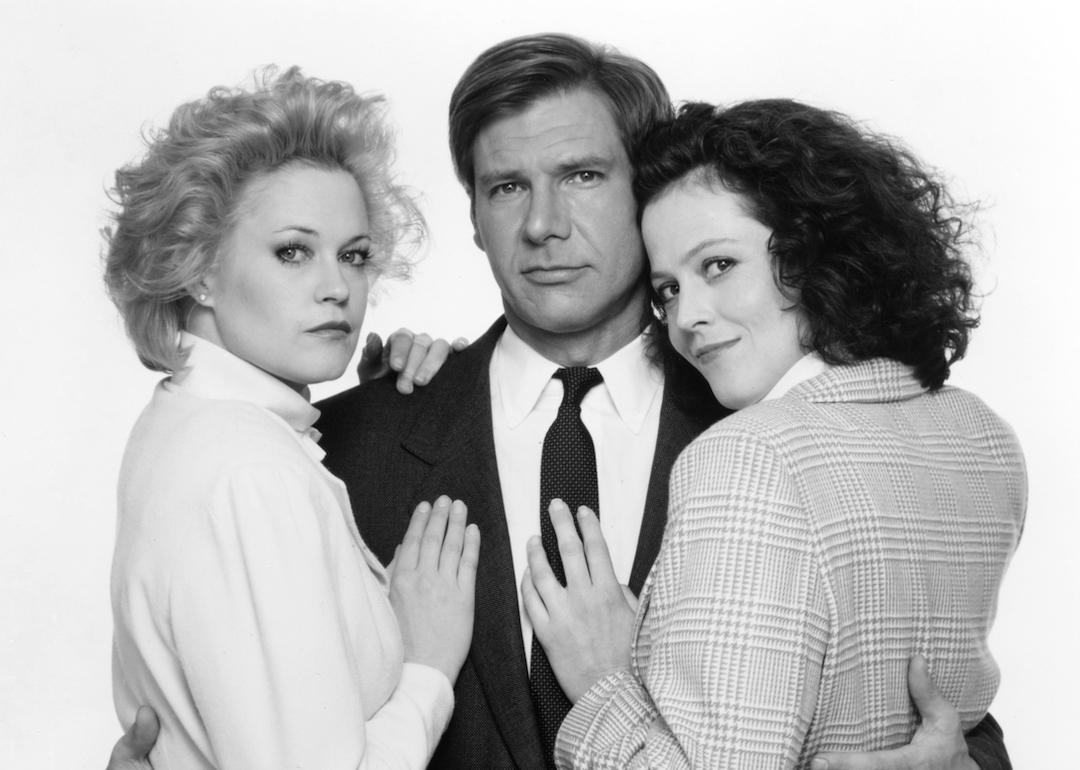 Actors Melanie Griffith, Harrison Ford, and Sigourney Weaver pose for a publicity portrait for the 1988 movie 'Working Girl.'