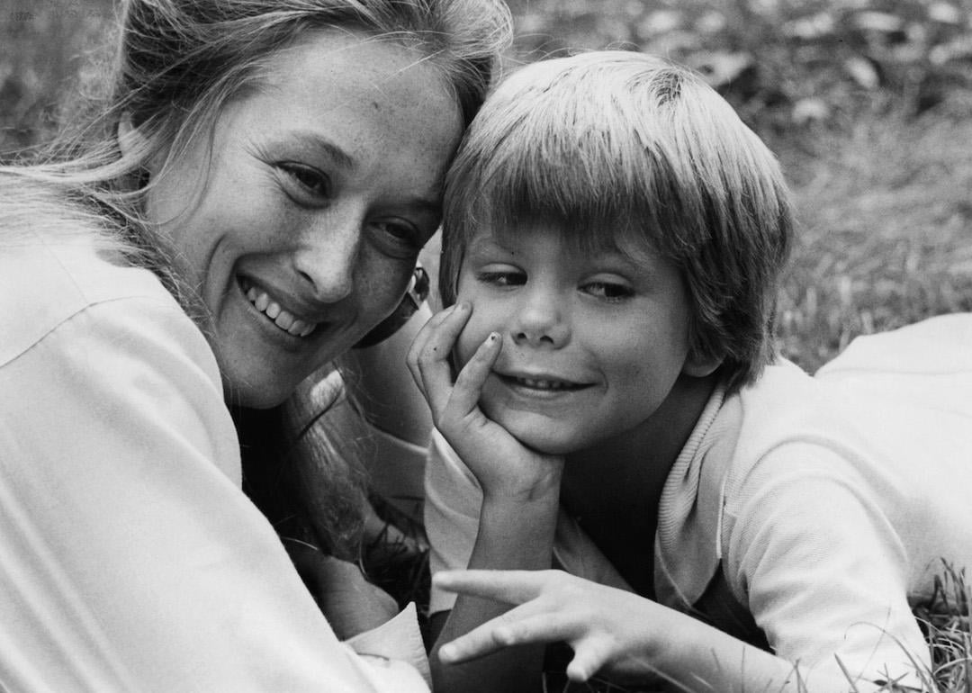 Actor Meryl Streep lies in the grass with child actor Justin Henry in a scene from the 1979 film 'Kramer Vs. Kramer.'