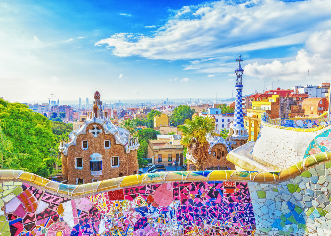 View fo the city from a mosaic bench in Park Güell in Barcelona, Spain.