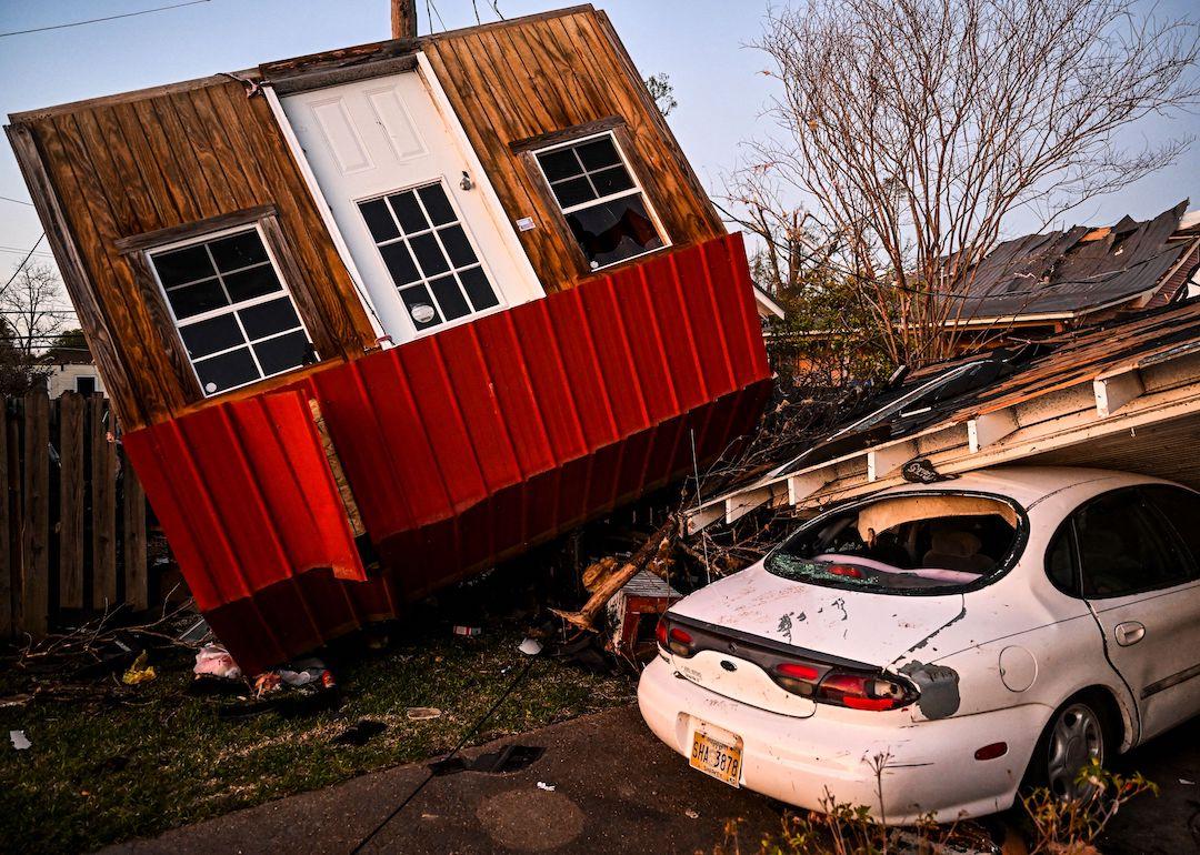 The remains of crushed house and cars are seen in Rolling Fork, Mississippi, on March 25, 2023, after a tornado touched down in the area.