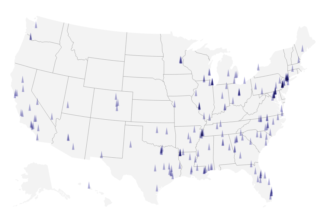Pale gray map with purple triangular markers showing the locations of all mass shootings in 2023