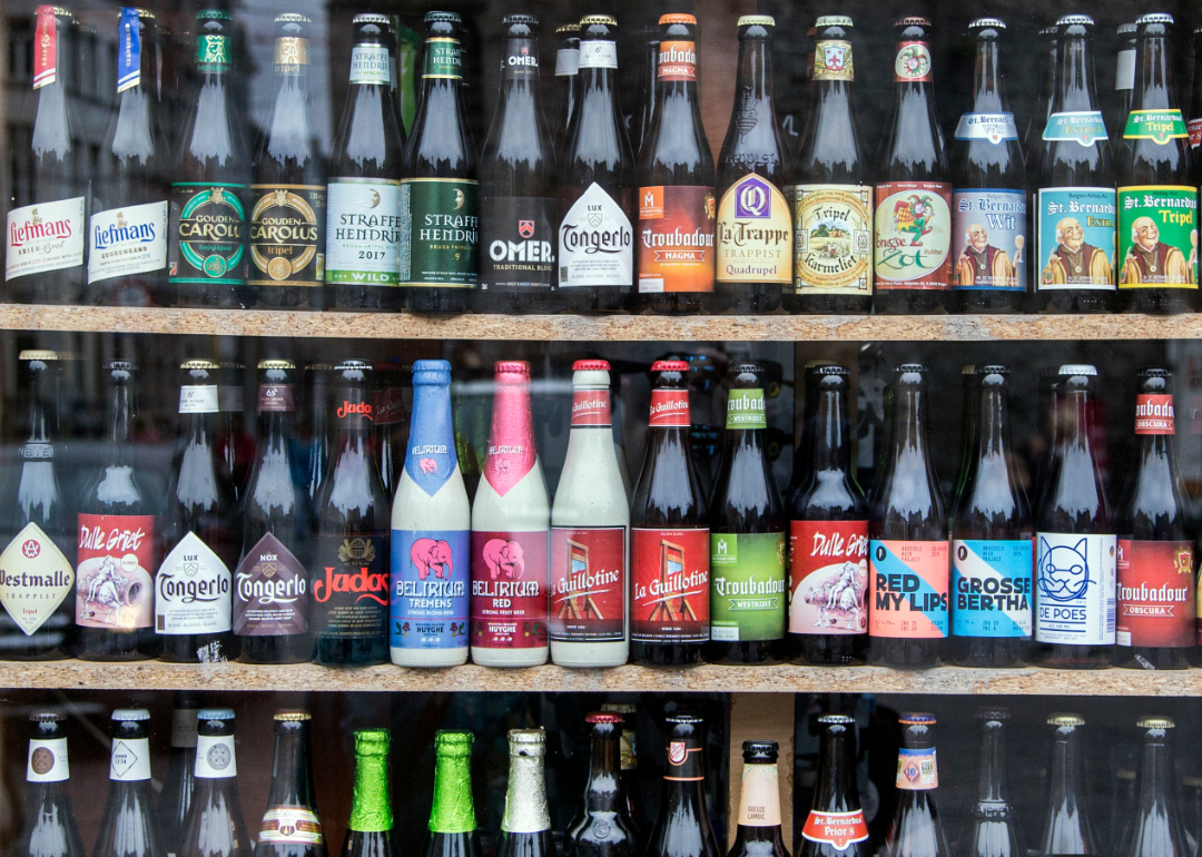 A selection of Belgian beers on shelves.