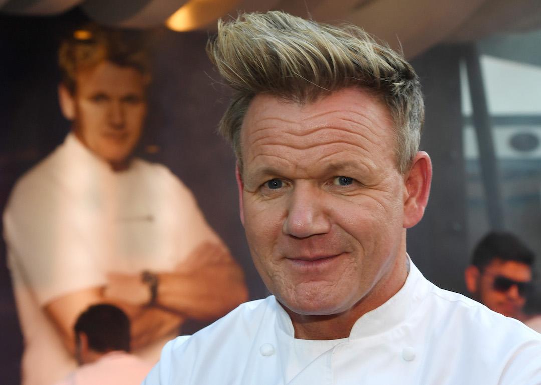 Gordon Ramsay wearing his chef's coat with his arms folded.