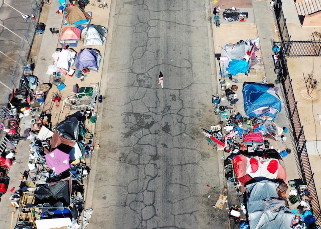 An aerial view of people gathered near a homeless encampment in the afternoon heat on July 21, 2022 in Phoenix, Arizona.