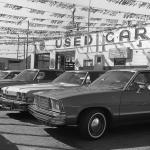 Used cars for sale in an OK lot in the 1970s.