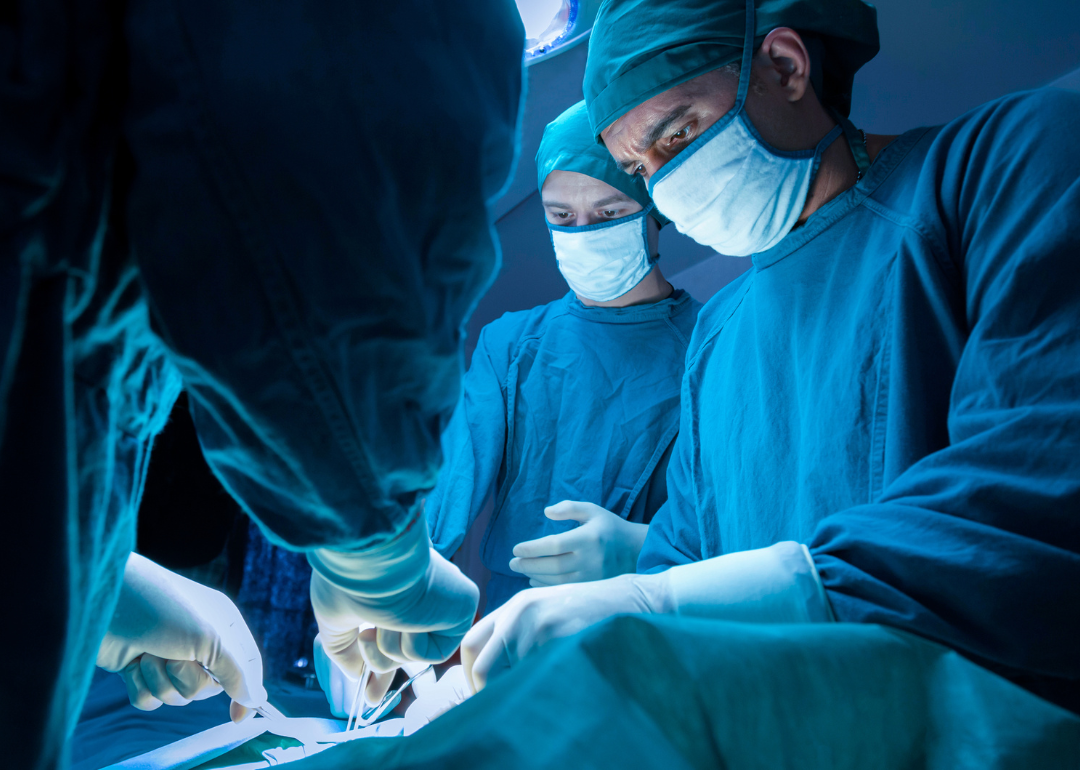 A team of surgeons in an operating room.