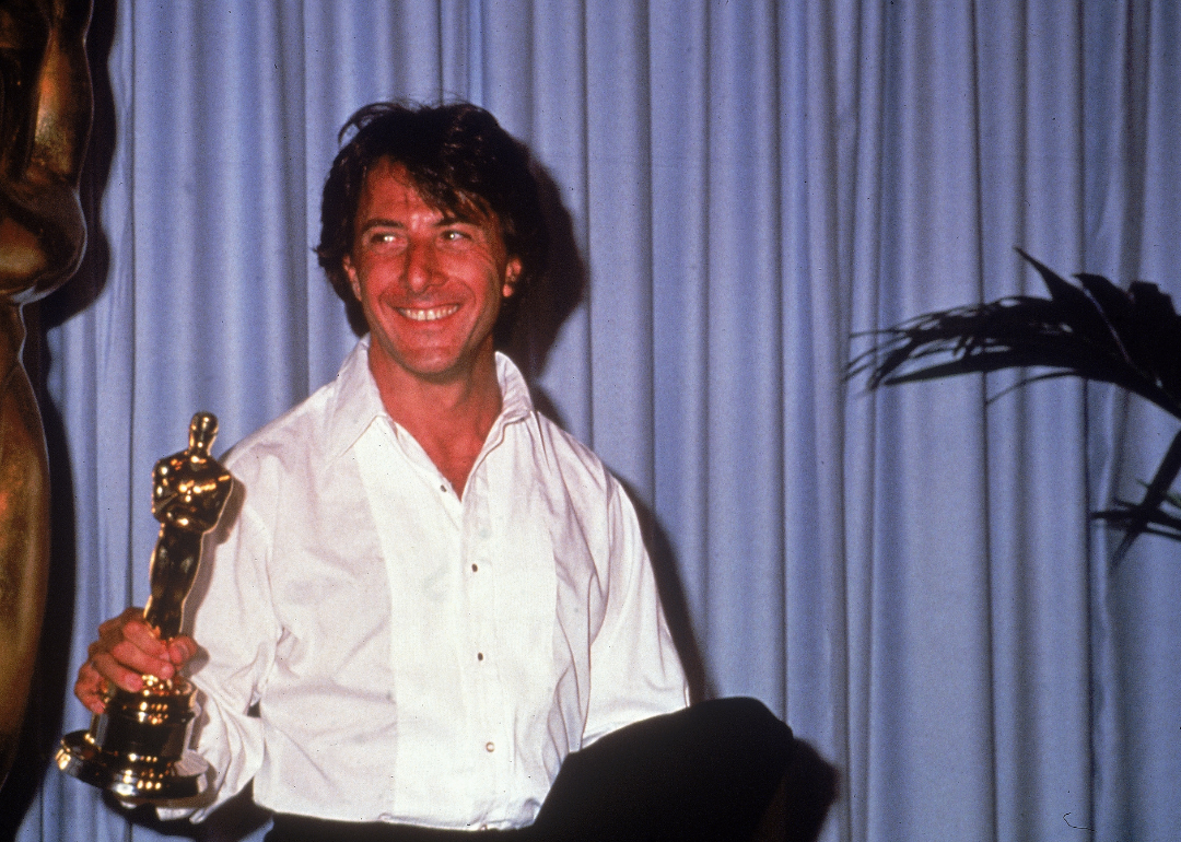 American actor Dustin Hoffman holds up the Oscar statuette he won for Best Actor for his role in the film "Kramer vs. Kramer," 1980.