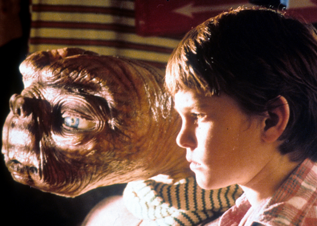ET looking out window with Henry Thomas in a scene from the film "E.T. The Extra-Terrestrial", 1982.