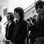 The Doors arrive at London Airport in 1968. From left to right: John Densmore, Bobby Krieger, Jim Morrison, and Ray Manzarek.
