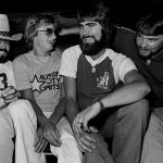 Randy Owen, Mark Herndon, Teddy Gentry, and Jeff Cook of the country music band Alabama in the back of a car in 1980.