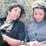 Actors Richard Gere and Brooke Adams laying in the hay in a scene from the 1978 film 'Days Of Heaven.'